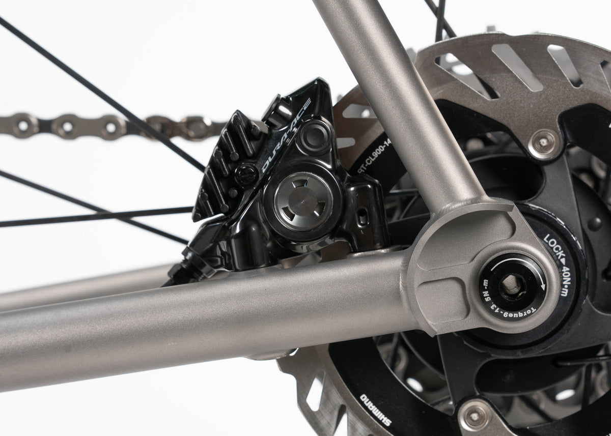 Flat mount disc brakes and compact socket dropouts